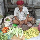 Colorful Street Market Scene with Traditional Attire and Ornate Architecture