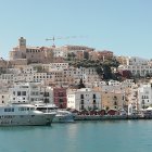 Sandstone Castle with Arched Bridges Over Tranquil Sea