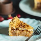 Whimsical painting of pie slice on cosmic background with clouds and fork