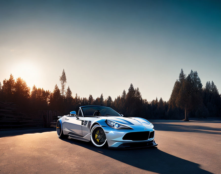 White Sports Car with Black Accents on Open Road at Sunset