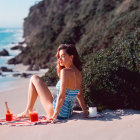 Woman in Blue Swimsuit on Beach with Ocean View