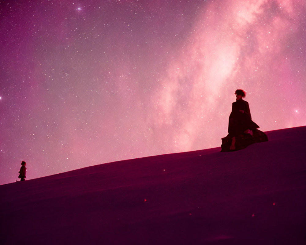 Silhouette of person on sand dune under pink starry sky with figure below