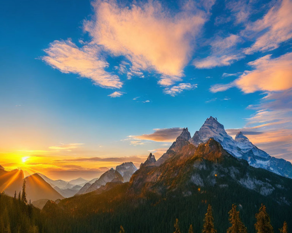 Vibrant mountain sunrise with golden clouds over forested landscape