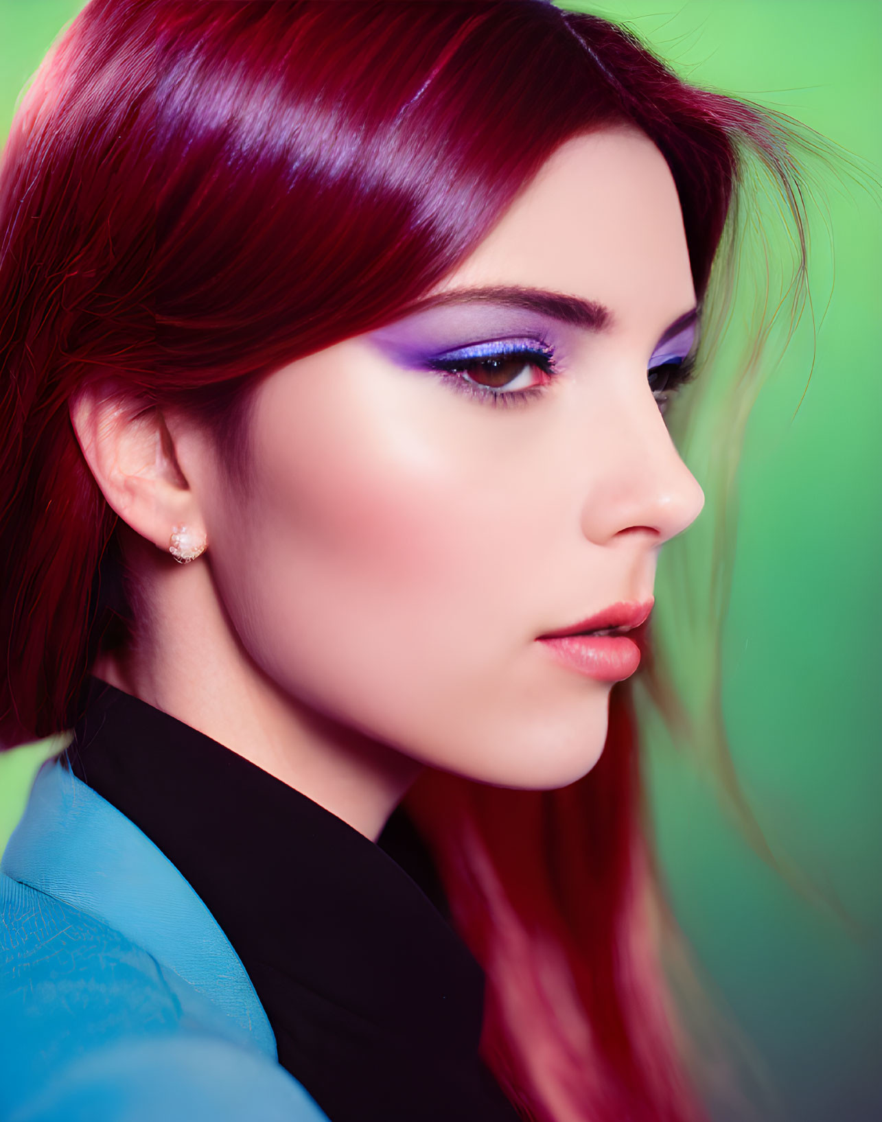 Woman with Red Hair and Purple Eyeshadow on Green Background