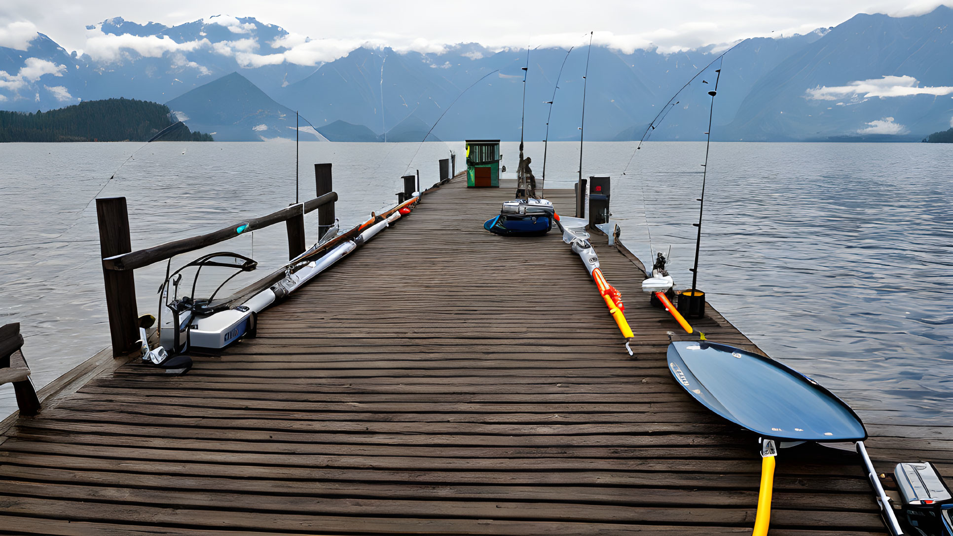 Wooden Dock with Fishing Rods Overlooking Calm Lake and Mountains