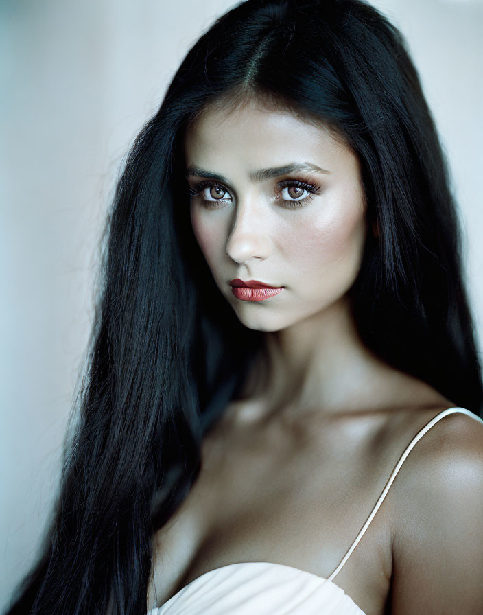 Portrait of Woman with Long Dark Hair and Striking Eyes in Red Lipstick