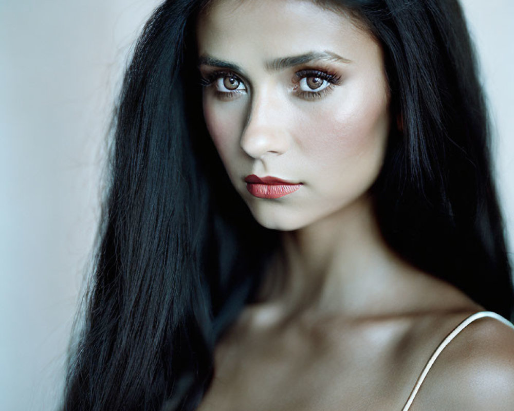 Portrait of Woman with Long Dark Hair and Striking Eyes in Red Lipstick