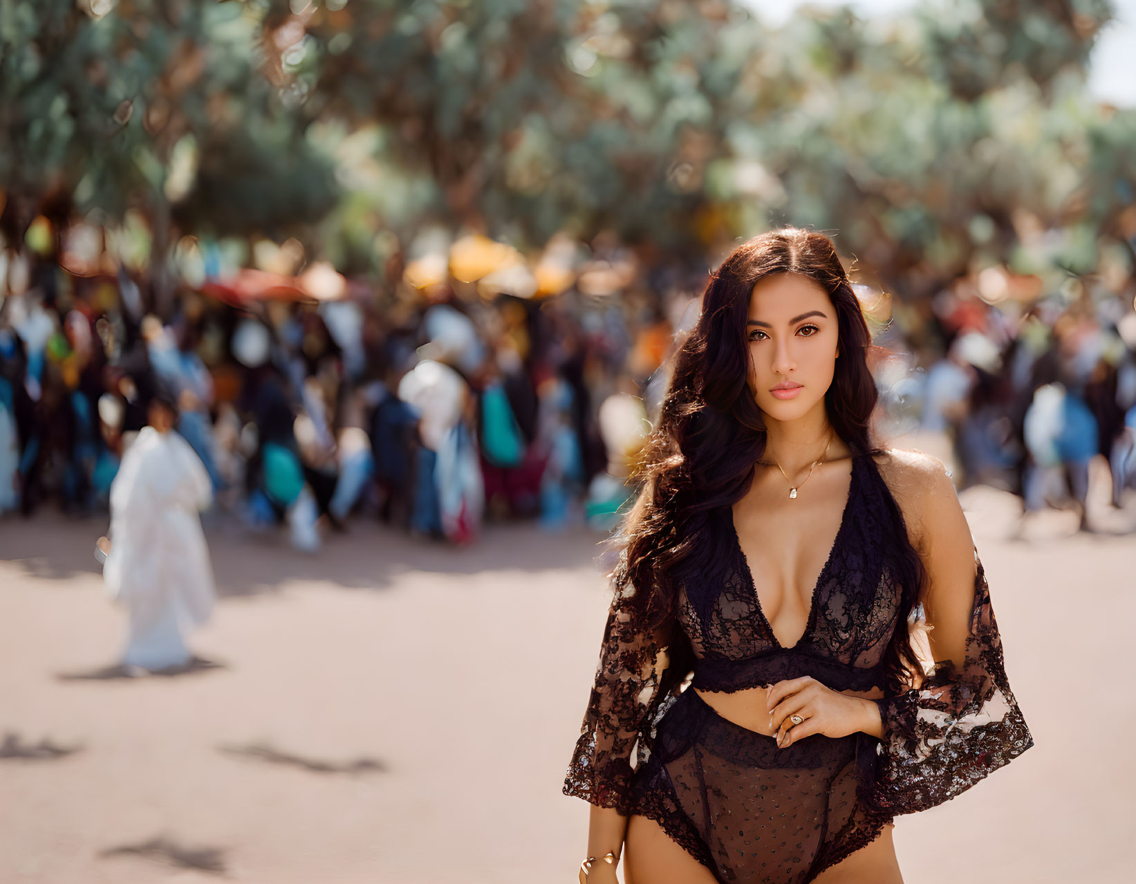 Woman in Black Lace Attire Poses Outdoors