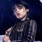 Person under clear umbrella gazing in rain with water droplets and glistening black adornments