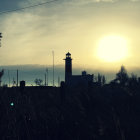 Scenic sunset view of twin lighthouses by the calm ocean