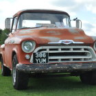 Rusty vintage pickup truck in rainy junkyard scene