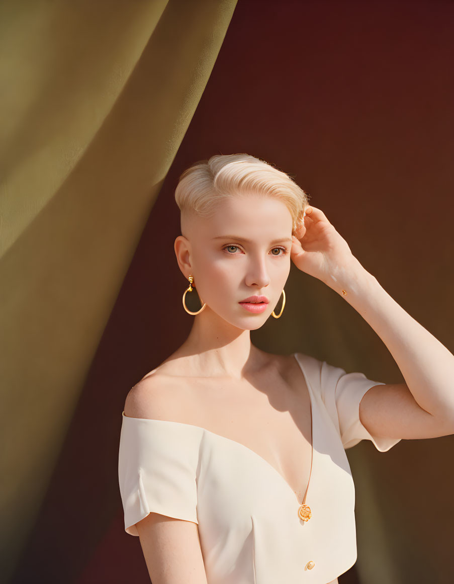 Blonde woman portrait with hoop earrings and raised hand