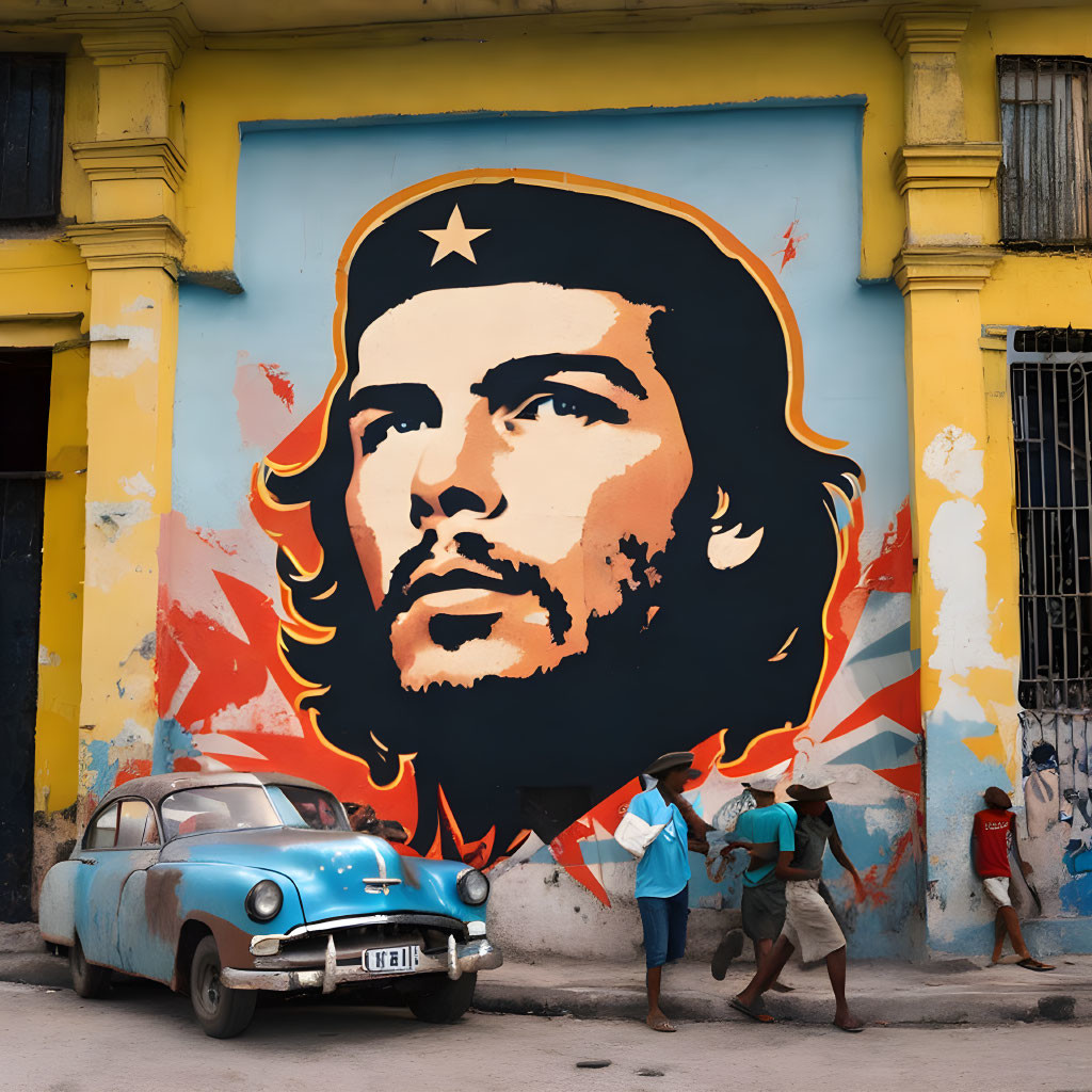 Large mural of Che Guevara on yellow building with flames, people, and blue car.