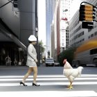 Woman in white dress and hat walks with chicken at urban crosswalk