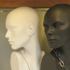 Mannequin heads: ivory vs. black with gold accents