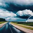 Dramatic sky with towering cumulonimbus cloud over road