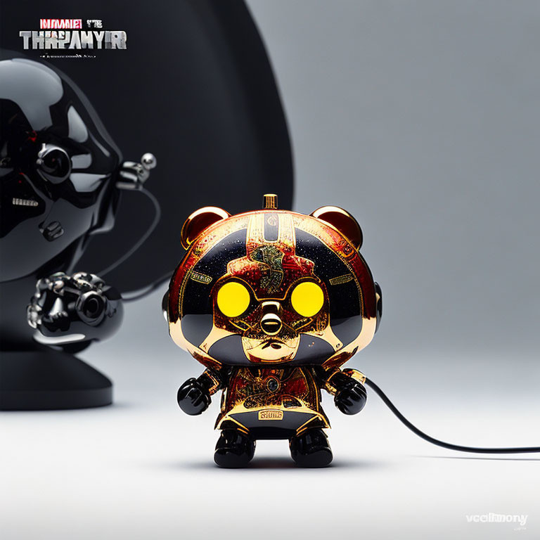 Intricate Gold, Black, and Red Designer Bear Toy with Headphones and Matching Speaker