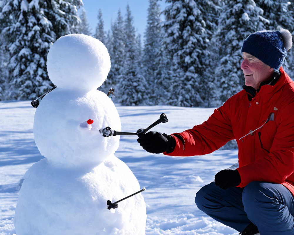 Person in Red Jacket Adding Arms to Snowman in Snowy Forest