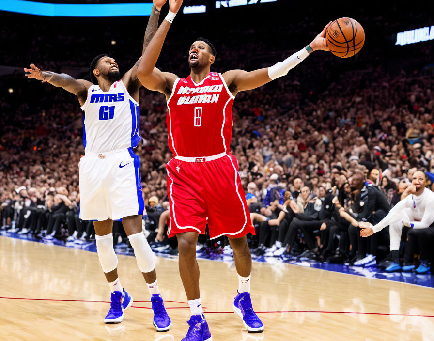 Basketball players in red and blue jerseys on court with crowd in background