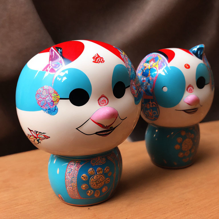 Japanese Kokeshi Dolls with Floral Patterns and Red Accents on Brown Background