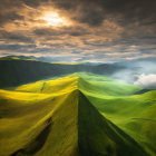 Dramatic sky over rolling green hills with sunburst contrast