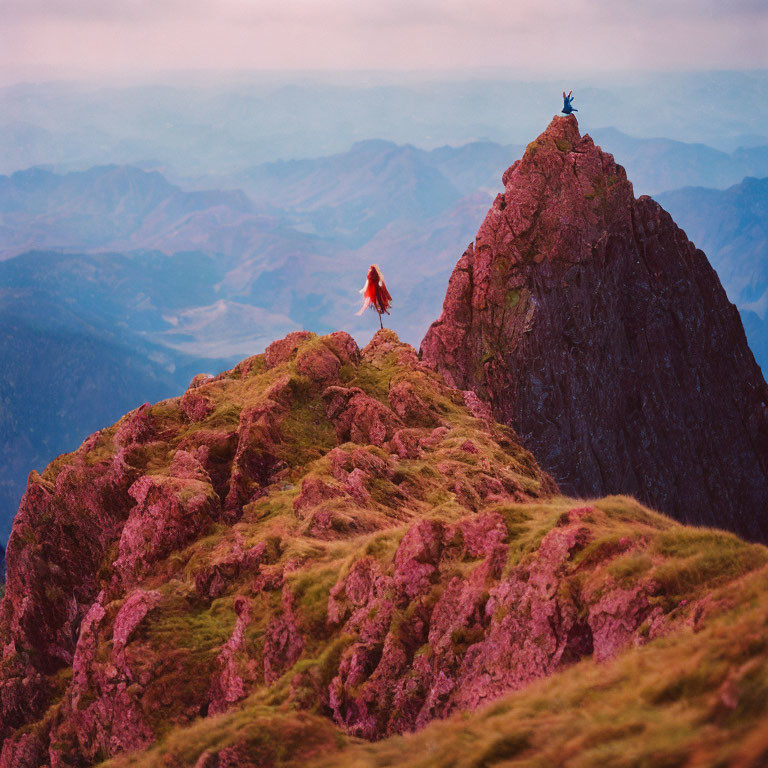 Two individuals on mountain peak under pink sky, one walking towards summit.