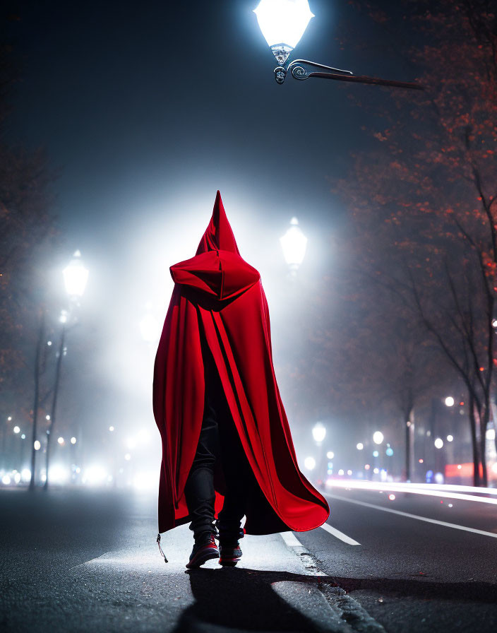 Person in Red Cloak Stands on Misty Night Street