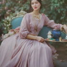 Vintage Pink Dress Woman Holding Blue Teapot Tray in Rose Garden