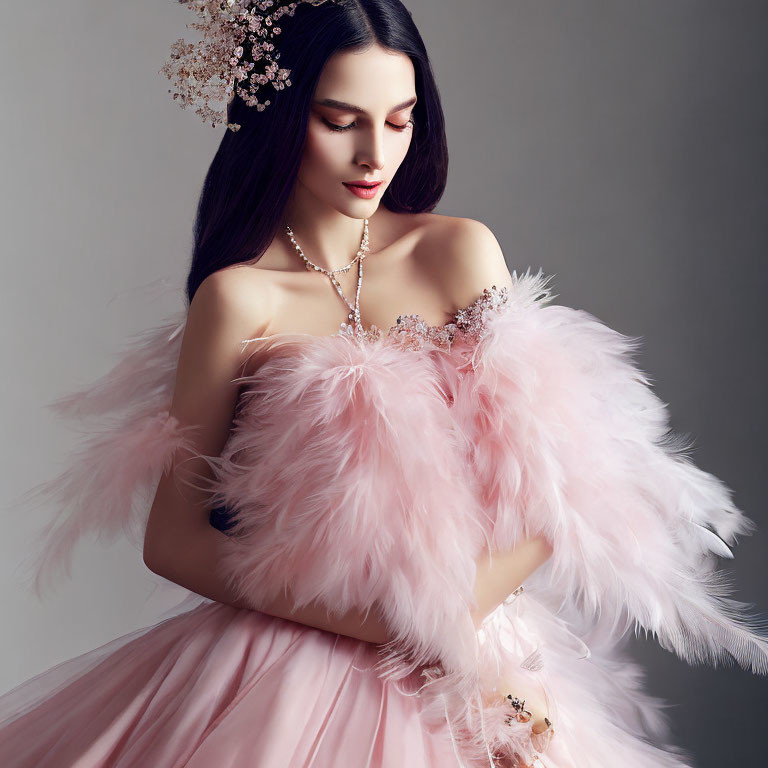 Elegant woman in pink tulle dress with feather details