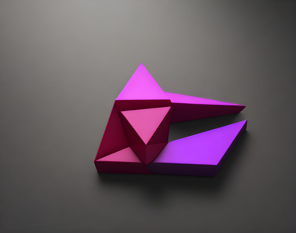 Magenta geometric origami shapes on grey background