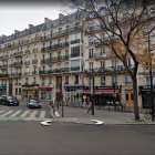 Parisian Street Scene with Modern Glass Canopy Entrance