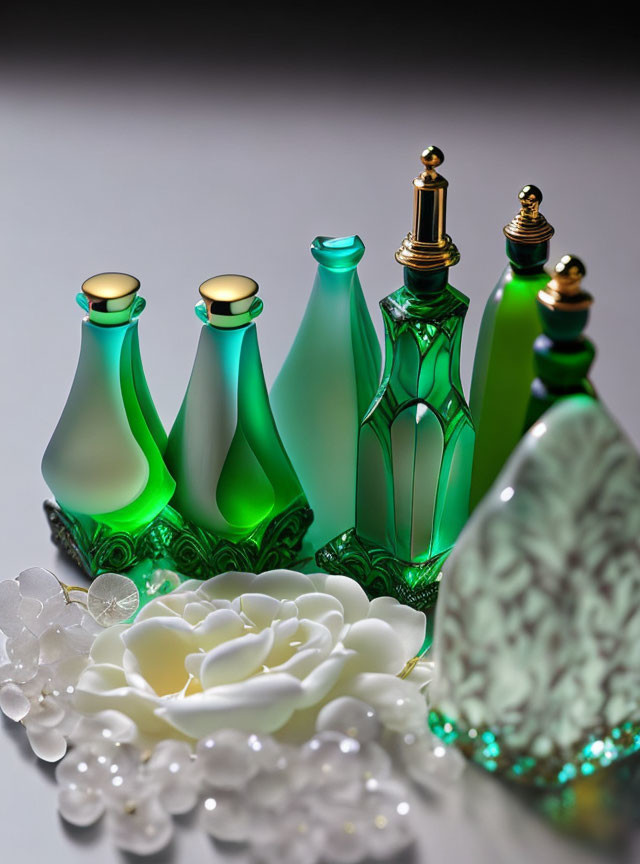 Assortment of Green Glass Perfume Bottles with Gold Caps