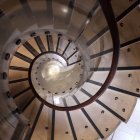 Transparent balustrade spiral staircase with autumn reflection