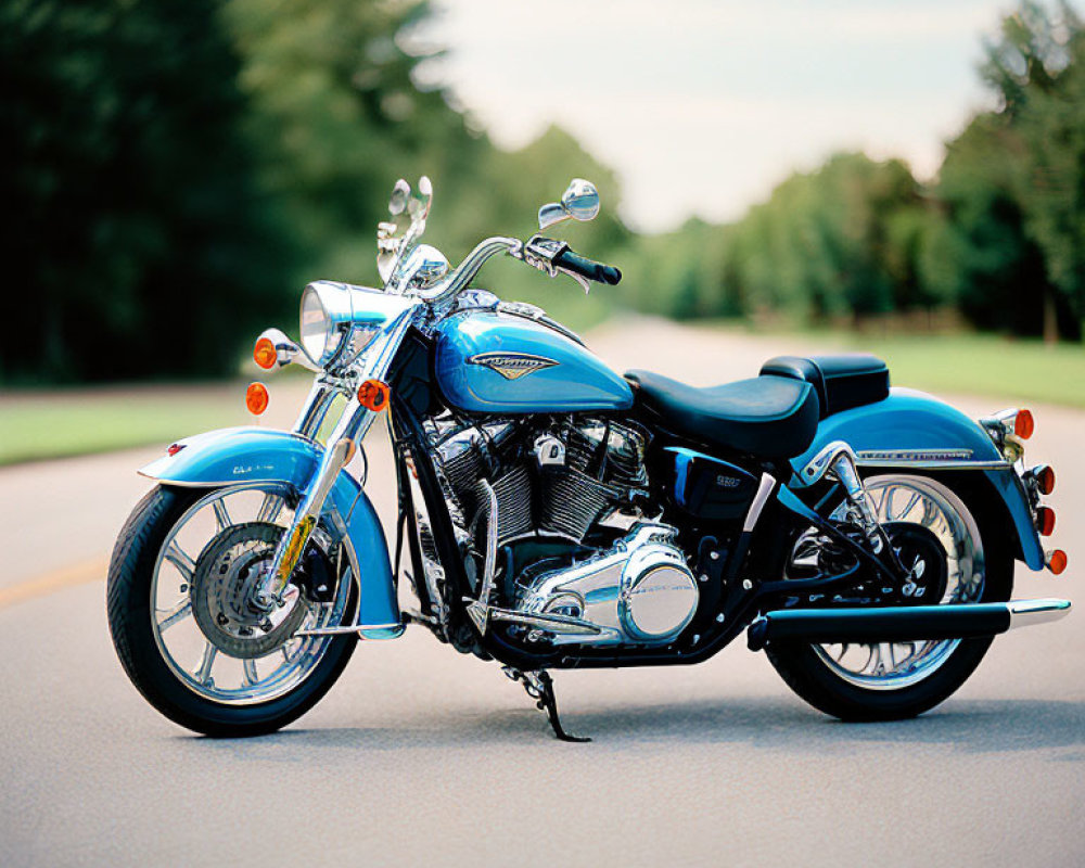 Blue Motorcycle Parked on Tree-Lined Asphalt Road