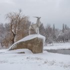 Colorful Winter Village with Clock Tower and Frozen Lake