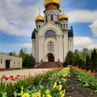 Eastern Orthodox Church with Golden Domes Surrounded by Flowers