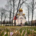 Neoclassical Pavilion at Sunset with Flowering Trees and Crocuses