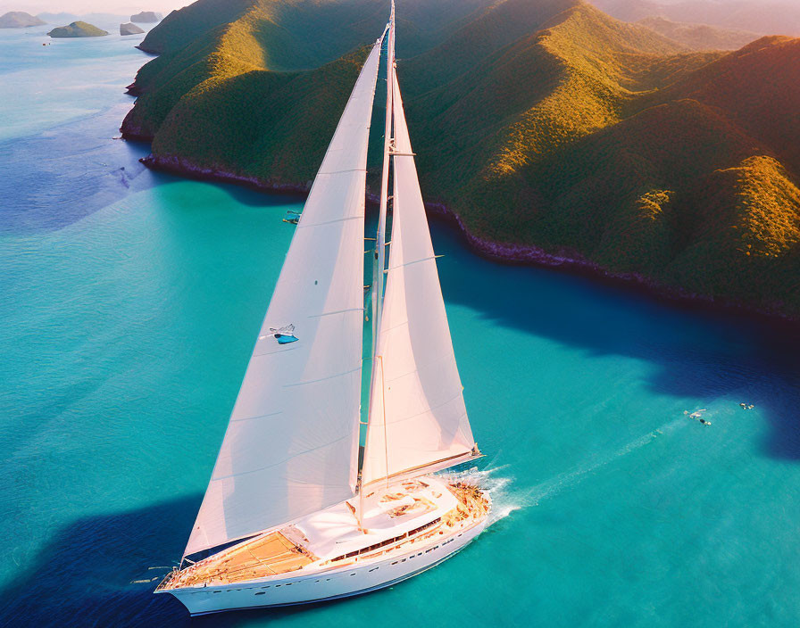 Luxurious sailboat sailing near green islands at sunset