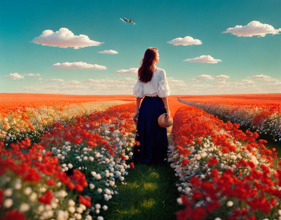 Woman in White Blouse Walking Through Field of Orange Flowers