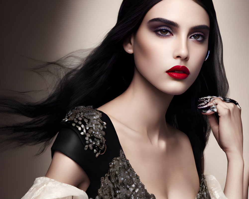 Portrait of woman with dark hair, bold makeup, and black lace dress