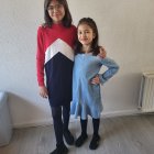 Two Girls with Winged Figures in Star-Themed Attire