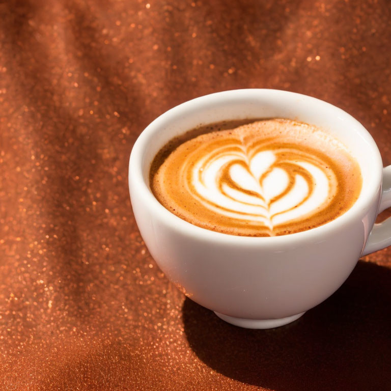 Cappuccino Cup with Heart Latte Art on Glittering Copper Background