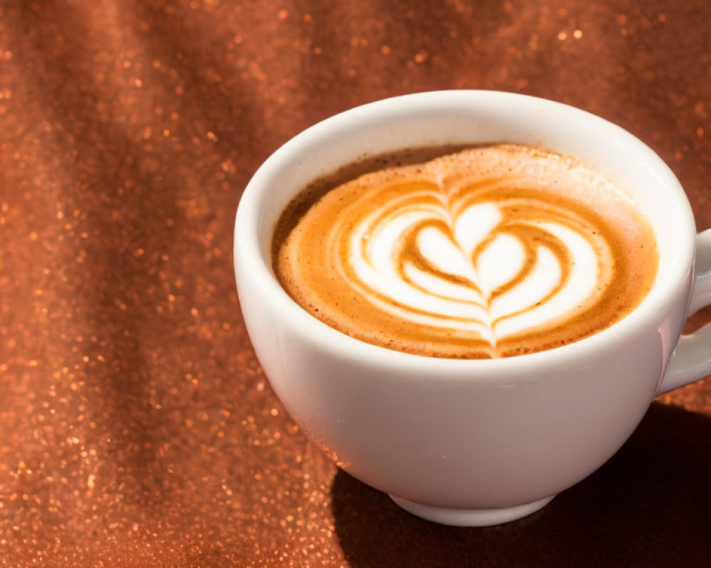 Cappuccino Cup with Heart Latte Art on Glittering Copper Background