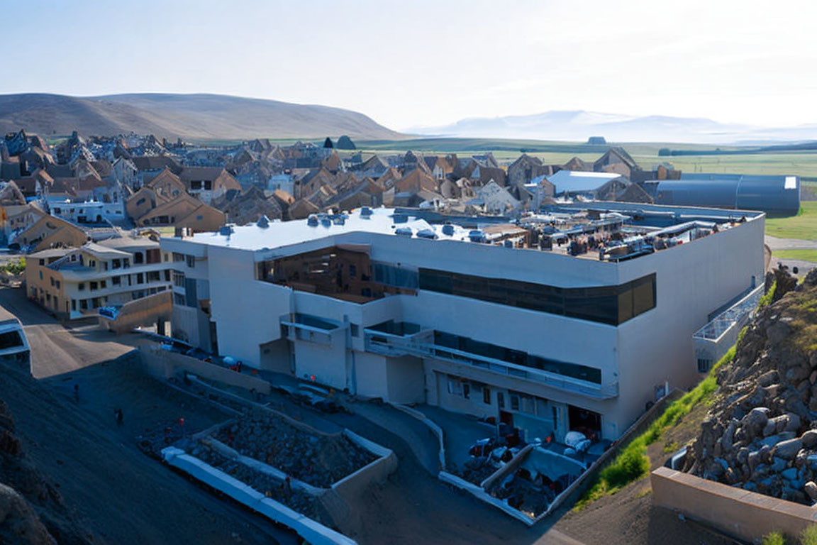 Modern building complex with geometric architecture in residential area.