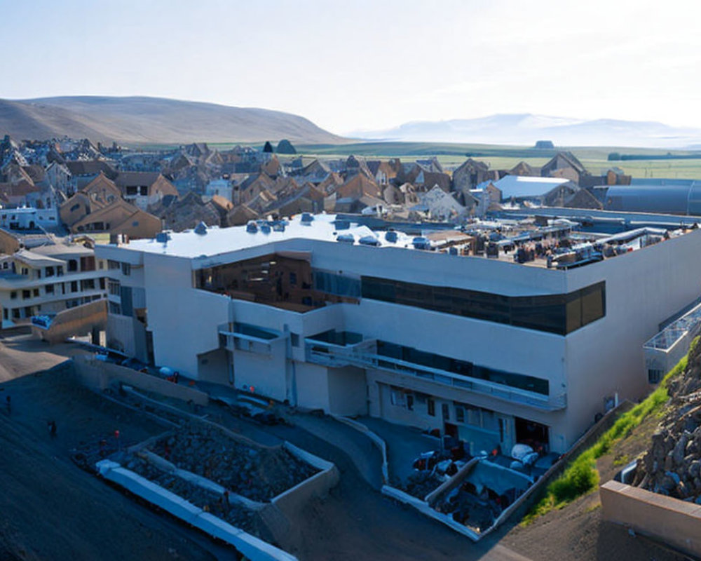 Modern building complex with geometric architecture in residential area.