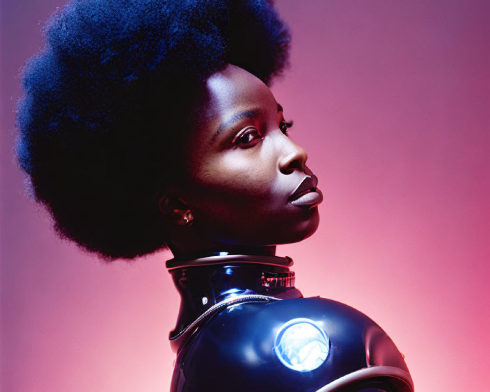 Portrait of Woman with Afro in Futuristic Outfit on Pink Background