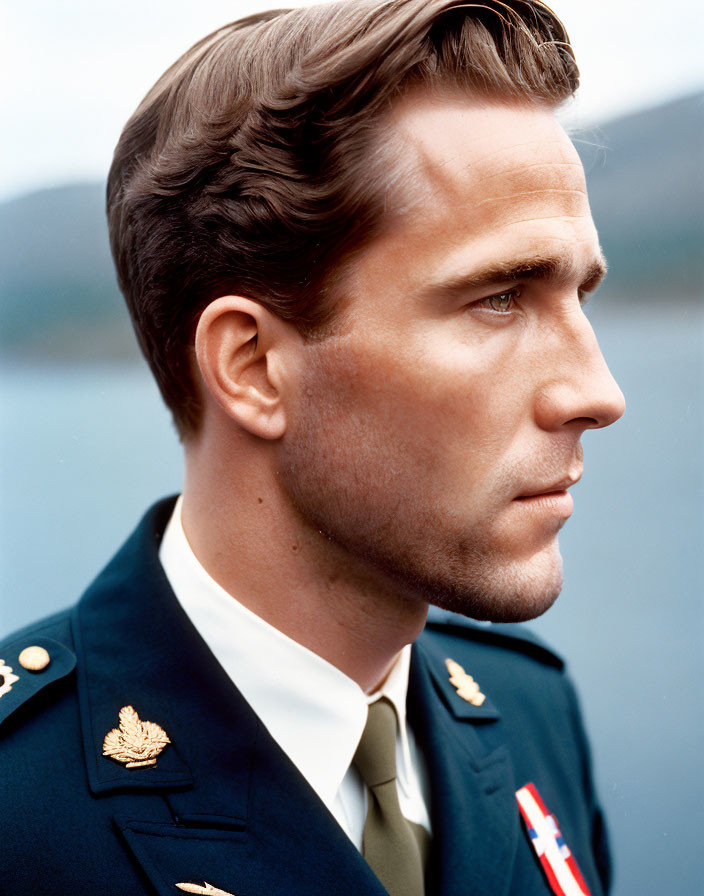 Man in Military Uniform with Short Styled Hair and Badges, Gazing Intently