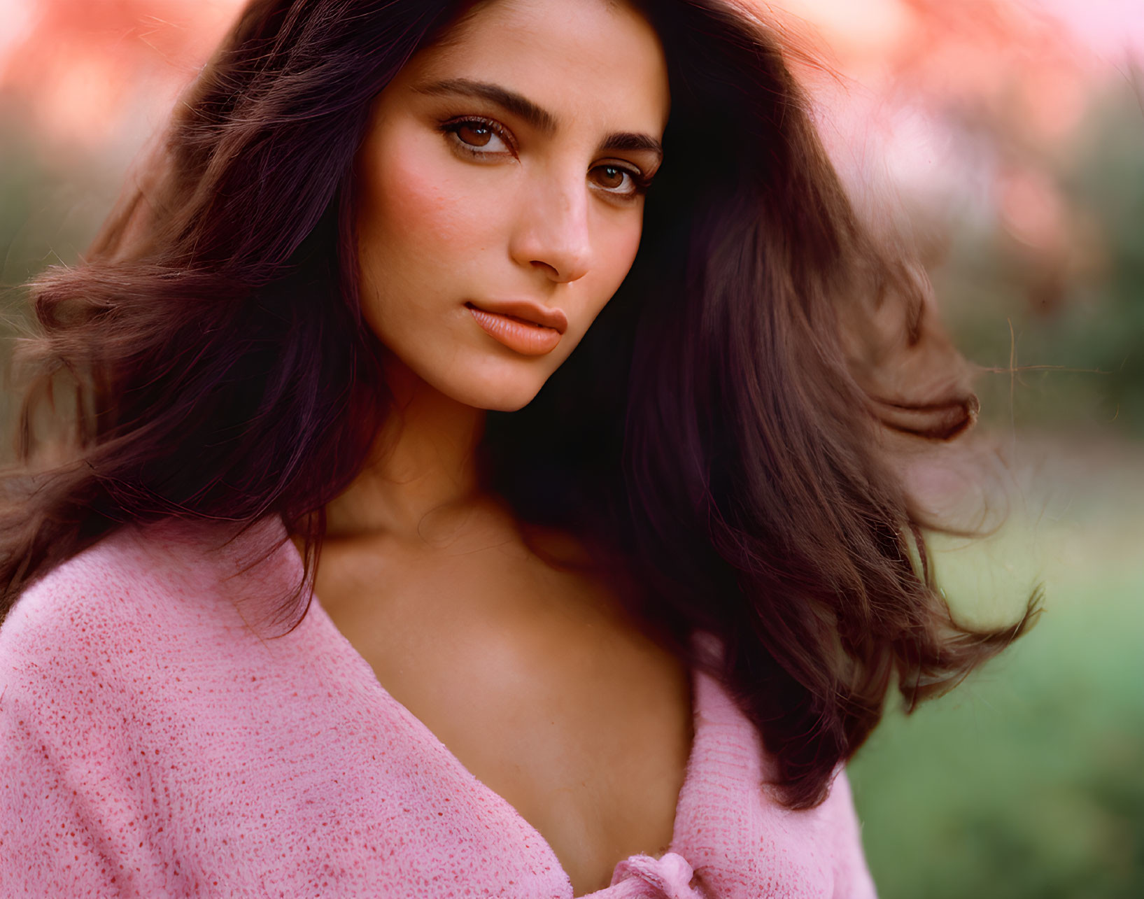 Woman in Pink Garment with Long Hair and Gaze, Nature Background