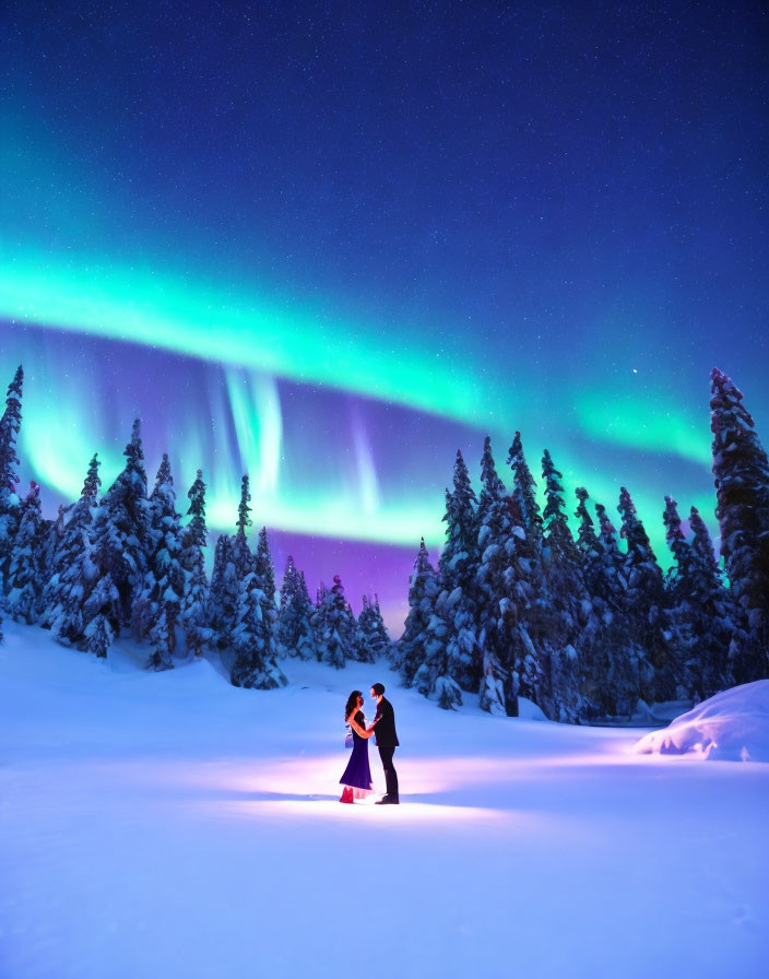 Couple Embraces Under Aurora Borealis in Snowy Forest Scene