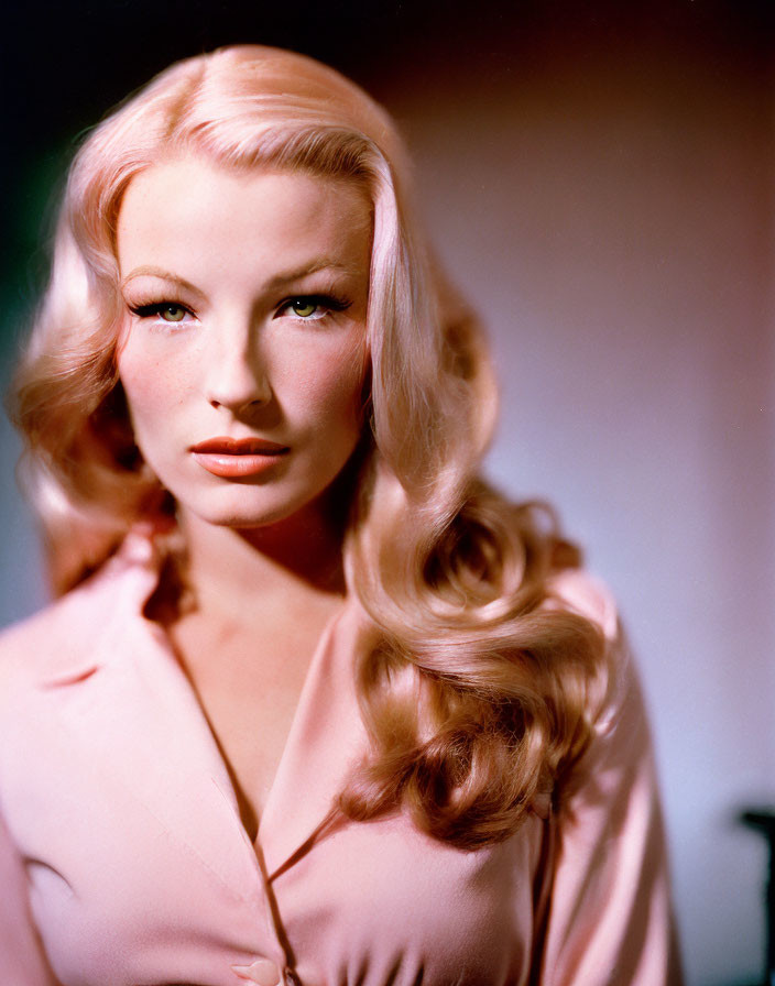 Blonde Woman in Pink Blouse with Wavy Hair